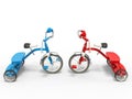 Blue and red tricycles