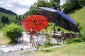 Blue and Red Umbrellas at The Witches Water, HochsÃ¶ll, Tyrol, Austria.