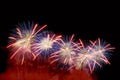 Blue, red, white fireworks on dark background Royalty Free Stock Photo