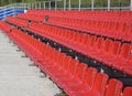 Blue, red, white rows of seats on the stadium Royalty Free Stock Photo