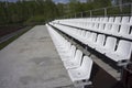 Blue, red, white rows of seats on the stadium Royalty Free Stock Photo