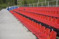 Blue, red, white rows of seats on the stadium Royalty Free Stock Photo