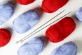 Blue and red yarn on a white background. Knitting - women `s needlework Royalty Free Stock Photo