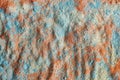 Blue, red and yellow cosmetic clay powder texture close up, selective focus. Abstract colorful background Royalty Free Stock Photo