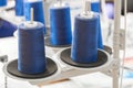 Blue reels of threads industry background, Spools of colored cotton thread, ordered composition Royalty Free Stock Photo