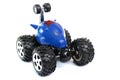 A Blue Remote Controlled Monster Truck Toy Car Against A White Backdrop