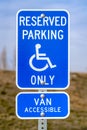 Blue Reserved Parking Van Accessible sign with a man on a wheelchair icon Royalty Free Stock Photo