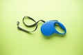 Blue retractable dog leash on a green background. Flat lay Royalty Free Stock Photo