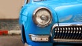 Blue retro car. Old vintage car. Headlight close up Royalty Free Stock Photo