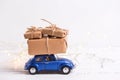 Blue retro car with wrapped box with presents Royalty Free Stock Photo