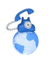 Blue retro telephone on a globe Royalty Free Stock Photo