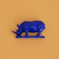 Blue rhino sculpture on yellow background. 3d rendering