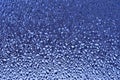 Blue ribbed glass surface. Abstract background.