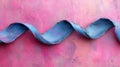 Blue Ribbon Abstract Wave on Pink Textured Background Royalty Free Stock Photo