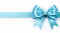 Blue ribbon bow on white background for banners and borders, ideal for birthdays and christmas Royalty Free Stock Photo