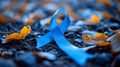 Blue ribbon laying on the ground Royalty Free Stock Photo