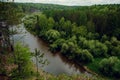 The blue ribbon of the river from the height of the mountains. Wild nature, taiga. Tourism. Far East, Sakhalin Island, Russia. Royalty Free Stock Photo