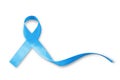 Blue ribbon symbolic for prostate cancer awareness campaign and men`s health in November month isolated on white background