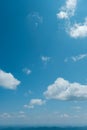 Blue Ridge Mountains of North Carolina, USA looking tiny and distant under deep blue sky with puffy white clouds Royalty Free Stock Photo