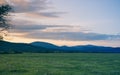 Blue Ridge Mountain sunset with pasture and color filled clouds Royalty Free Stock Photo