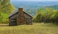A Log Cabin in the Mountains Overlooking the Valley Royalty Free Stock Photo