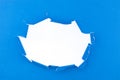 Blue ripped open paper on white background,space for your message on white torn paper Royalty Free Stock Photo