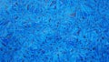 Blue ripped water in swimming pool, Ripples and flow distorting tile lining reflection, Abstract background, Top view. Royalty Free Stock Photo