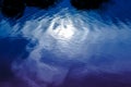 Blue rippled water detail and reflection of the bright moon in r Royalty Free Stock Photo