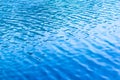 Blue ripples on the surface of water in lake Royalty Free Stock Photo