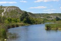 the river flows under the mountain.