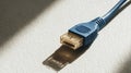 Blue RJ45 Ethernet patch cable connector with close up gold contacts, macro detail of network hardware for fast data transfer Royalty Free Stock Photo