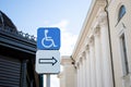 Blue road sign parking for people with disabilities on the background of the sky Royalty Free Stock Photo