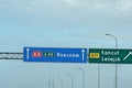 Blue road sign pointing to the highway to Rzeszow, Lancut and Lezajsk.