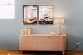 Blue room modern dresser, table lamp and design painting on the wall