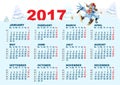 Blue Rooster symbol 2017 and calendar. Cartoon chicken skiing