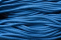 Blue rope for belay. Isolated photo of climbing knots. Top view of cables
