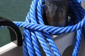 The blue rope is visible on the mooring bollard Royalty Free Stock Photo