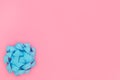 Blue Rosette Bow on Contrast Pink Background