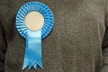 Blue Rosette on Conservative Party Supporter Royalty Free Stock Photo