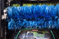 blue rotating brushes in automatic car washing Royalty Free Stock Photo