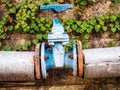 Large blue round valve with pipes for closing the water Royalty Free Stock Photo