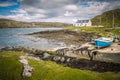 Blue rowing boat and white cottage near to Flodbay on the Isle of Harris Royalty Free Stock Photo