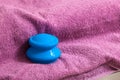 Blue rubber cupping glass on pink towel for vacuum massage Royalty Free Stock Photo