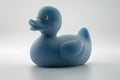 A toy duck with a blue rubber ducky is perched on a white surface