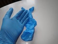 Blue rubber gloves protecting hands