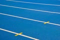 Blue running track with white lines