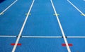 Blue running track with white lines