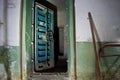 Blue rusty hermetical door of old abandoned Soviet bomb shelter