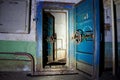 Blue rusty hermetical door of old abandoned Soviet bomb shelter Royalty Free Stock Photo
