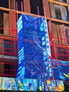 Blue Safety Mesh and Colourful Graffiti on Commercial Building Scaffolding, Sydney, Australia